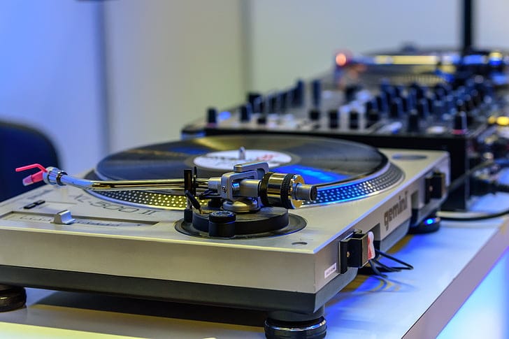 A collection of vinyl records representing the musical archive that sampling draws from